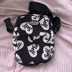 Petals and peacocks black and white cross body bag