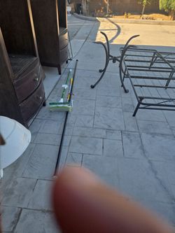 Free. Duster rod, mop, curtain rod