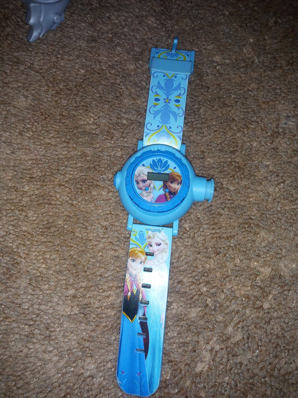 Elsa watch. Light up in the. Night if you click a button and turn your lights of light it to the wall