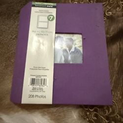 purple photo album branded by Pinnacle Frames & Accents