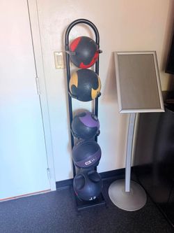 Weight medicine balls with rack