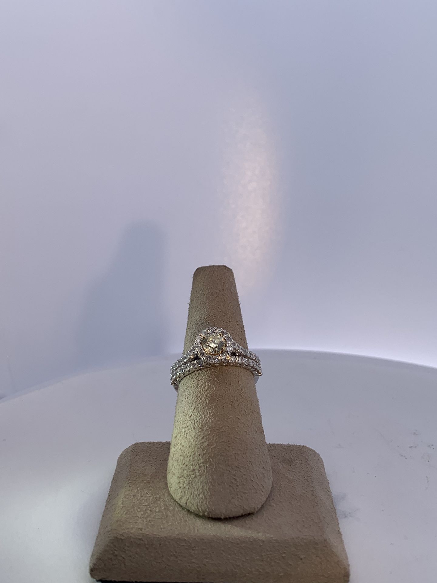 lady’s Two-tone 14 Karat Wedding Set 5.5 with one center 0.50ct round brilliant cut diamond and 0.90Tw side round cut diamonds halo and the band