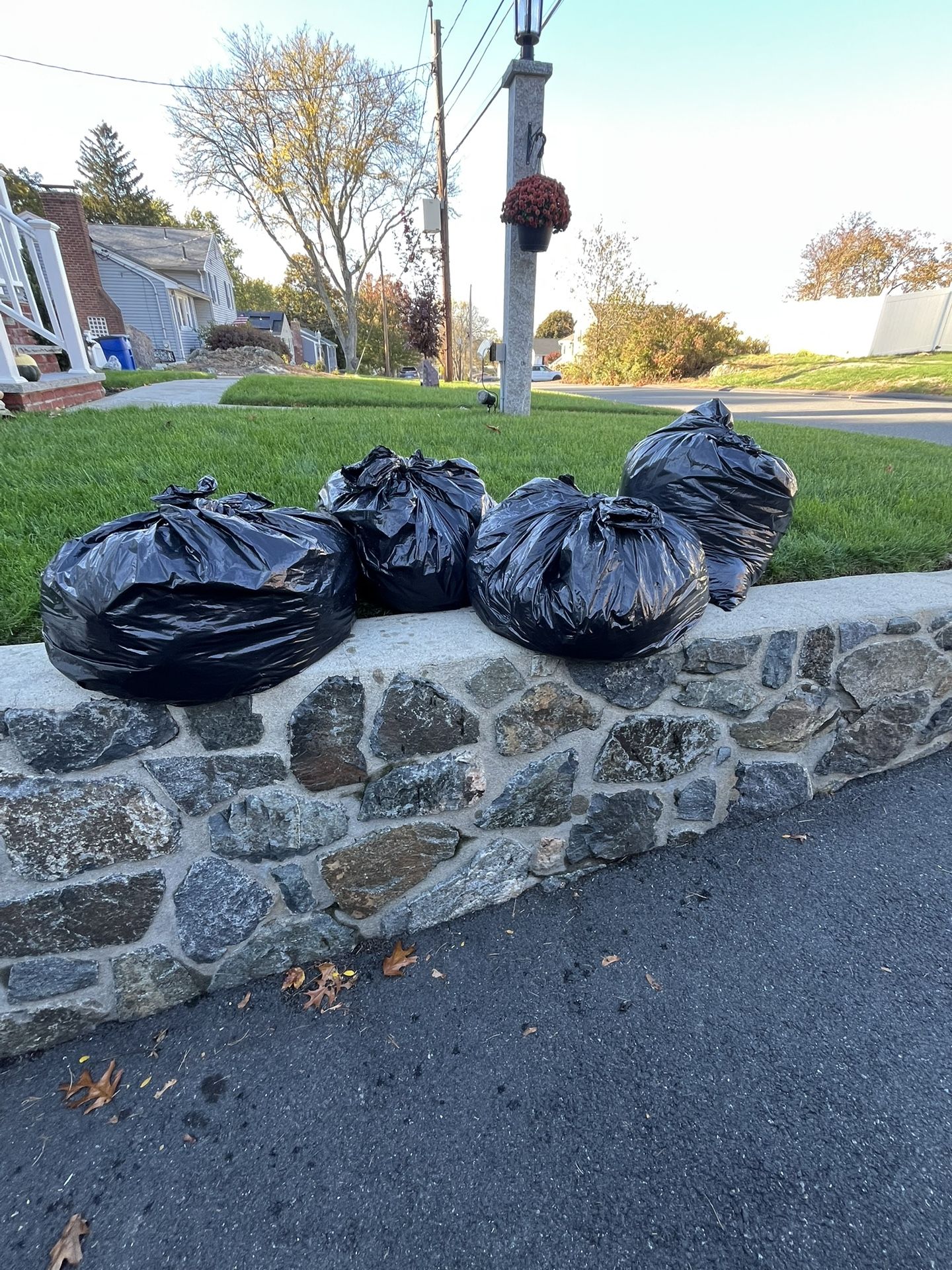  (4) large trash bags full of men’s clothing