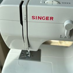 SINGER. Sewing. With An  OVERLOCK