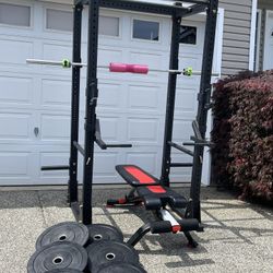 Heavy duty Titan X-3 Series Flat Foot Power Rack with olympic bumper plates, barbell and bench