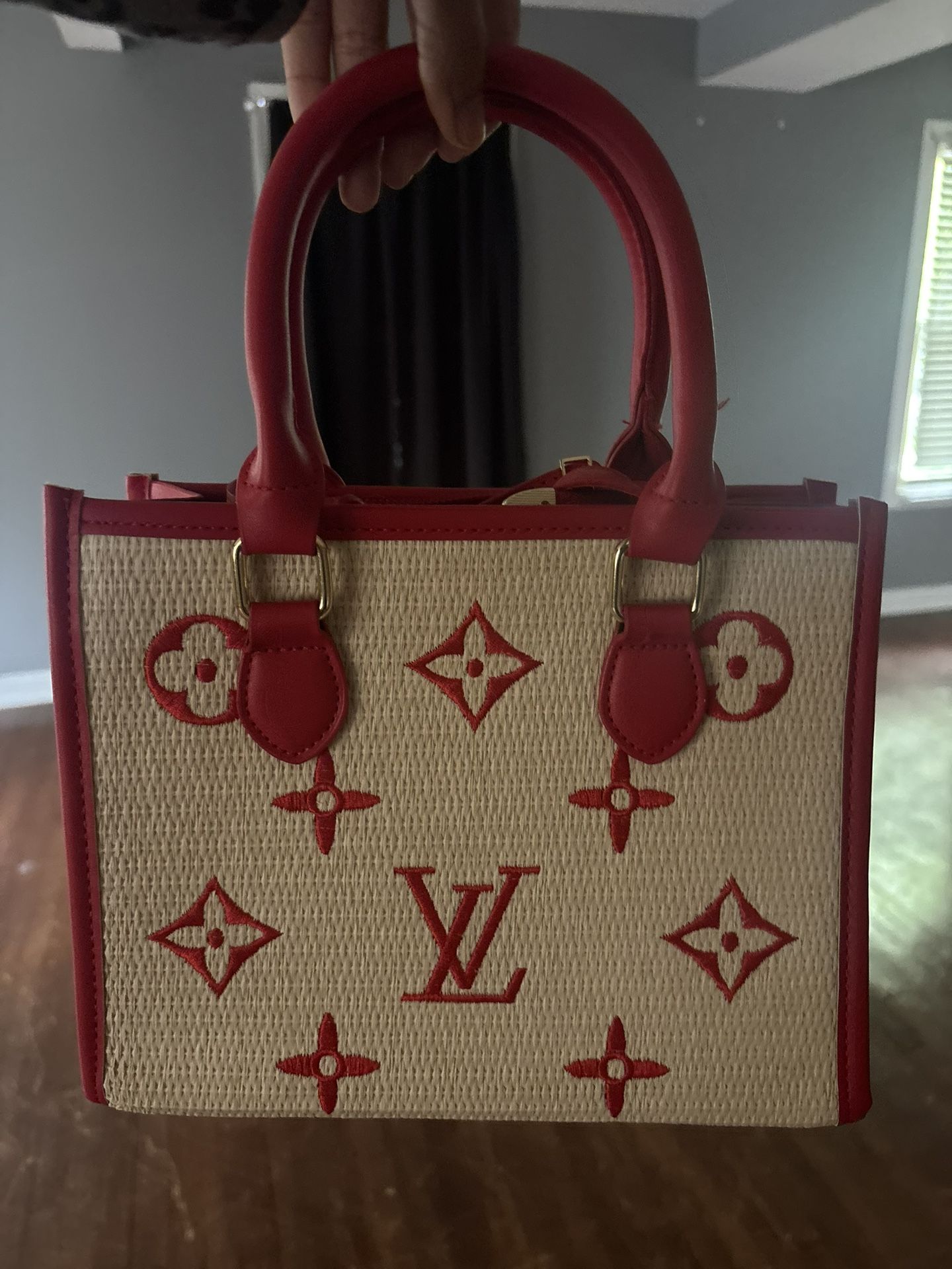Red Hand Bag One Has Shoulder Strap The Other Doesn’t!