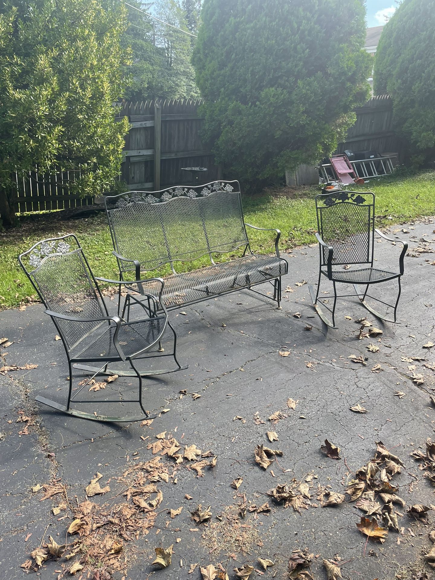 Three piece vintage iron patio set/One glider, two rocking chairs!