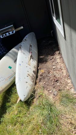Old wind surf paddle board