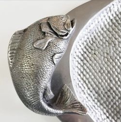 a large Midcentury Pewter Platter with fish handles. The tray has 2 fish handles and the surface is done in a fish scale pattern