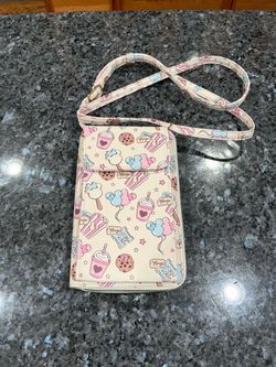 Disney Mickey Mouse "Magic" sweet treats phone crossbody purse features a repeating pattern of pastel treats and snacks.  Brand new never used.  Smoke