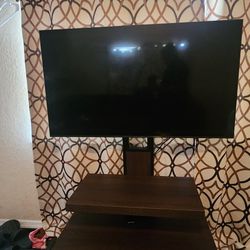 55" TV Samsung And TV Stand 200$ Or Best Offer