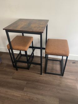 Dining table and cushioned seats