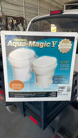 Thetford. Aqua magic, five high hand, flush RV toilet.