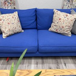 Luxury modern linen couch, coffee table, end table and console come together