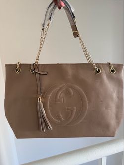 New Tan GG bag with gold accents.