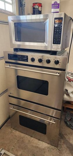 GE Monogram wall electric oven and GE Profile microwave, stainless steel