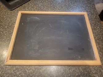 Black chalkboard, framed in wood, approx 18x24"
