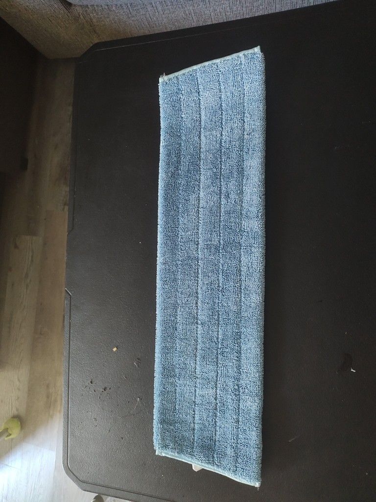 Reusable microfiber mop pad .