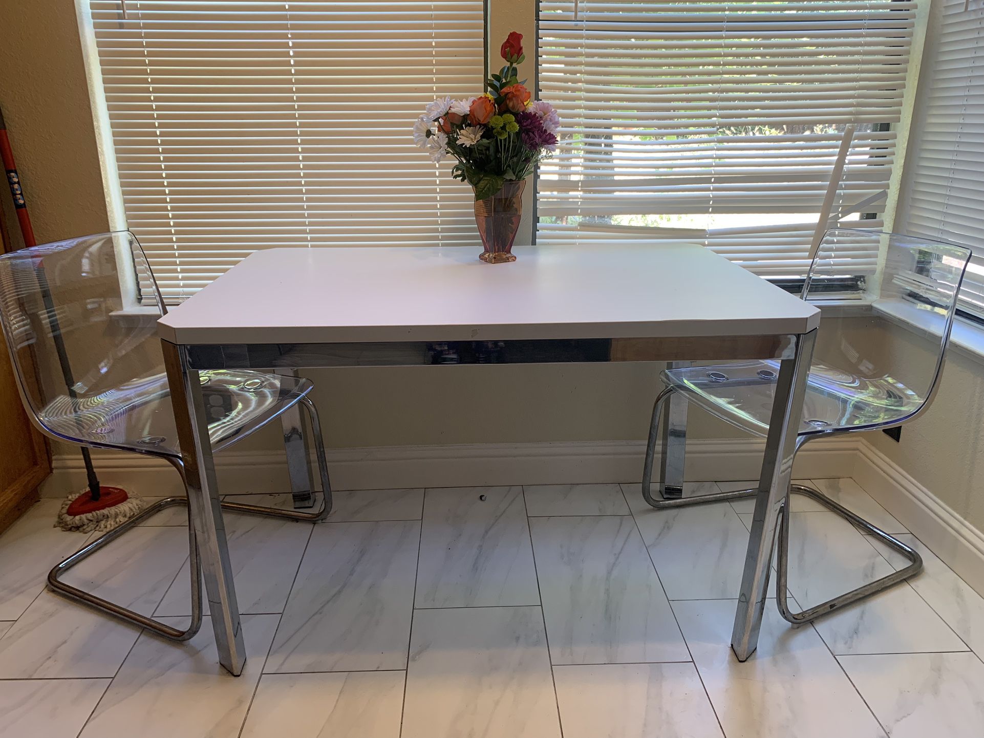 White and chrome dining table with 2 acrylic chrome chairs