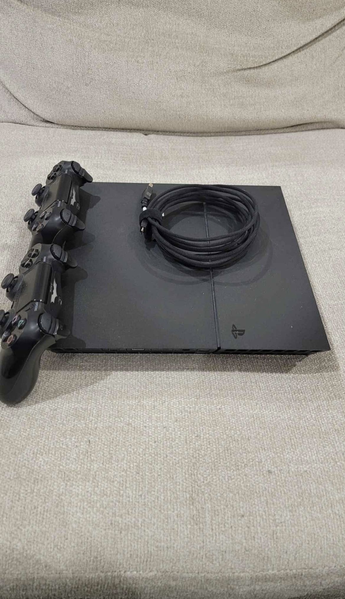 PlayStation 4 with 2 controllers, power cable, And Hdmi Cable.