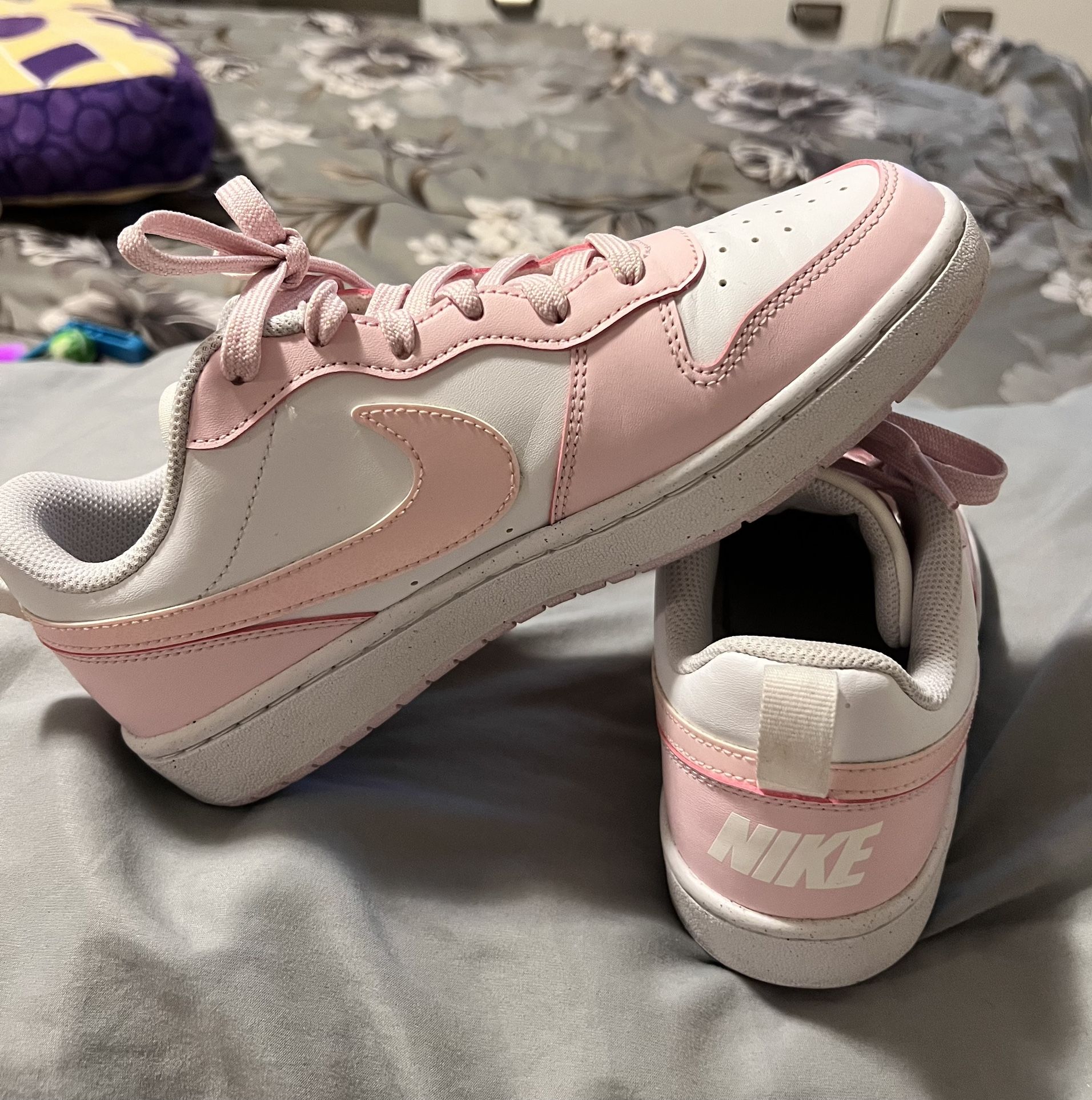 Pink Nike (woman’s size 7.5 or kids 6Y)