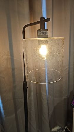 Iron seeded glass axel farmhouse style floor lamp