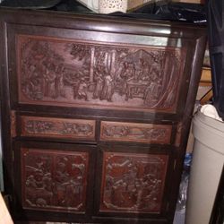 vintage heavily hand carved asian cabinet
