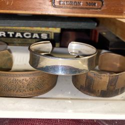 Three vintage bracelets to our bell South copper with etching one is sterling silver, and all three are sizable