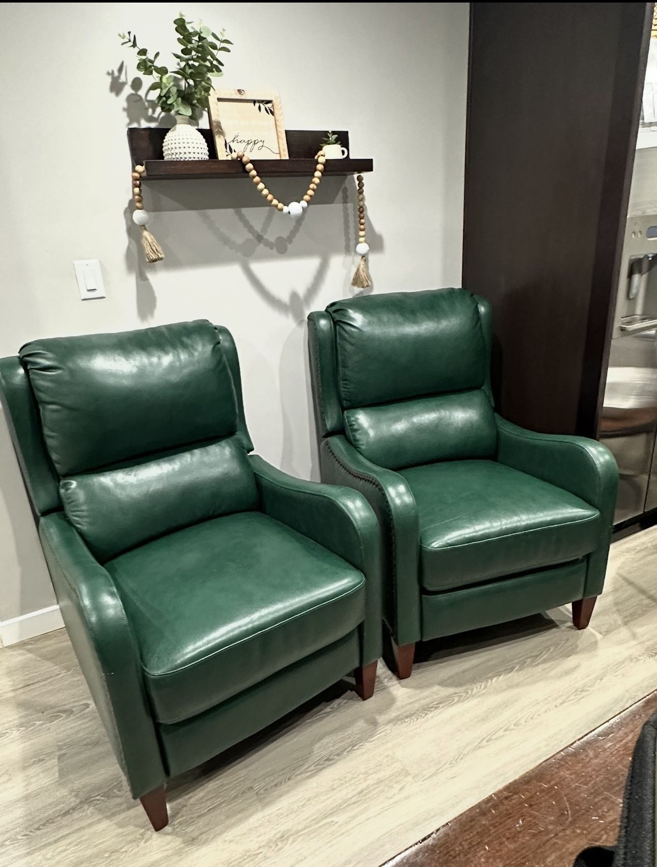2 green leather sofas