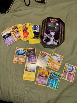 200+ Pokémon cards + tin