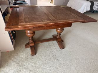 Solid wood table - converts from a kitchenette to a dinning table.
