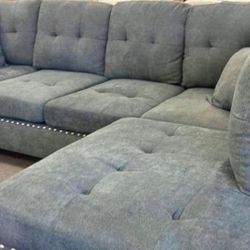 sectional sofa with 2 accent pillows. Comes new in 2 boxes