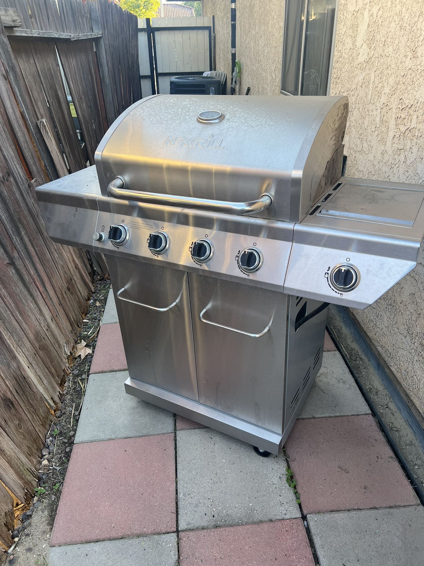  Nexgrill 4-Burner Propane Gas Grill in Stainless Steel with Side Burner