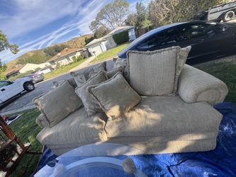 Beige couches with pillows