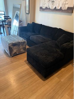 Brand new black corduroy sectionals with free ottoman