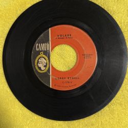This collectible is a 1960 vinyl 45 RPM single by Bobby Rydell titled "I'd Do It Again" on the Cameo Records label. 