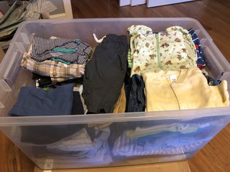 A full bin of 0-3 baby boy clothes