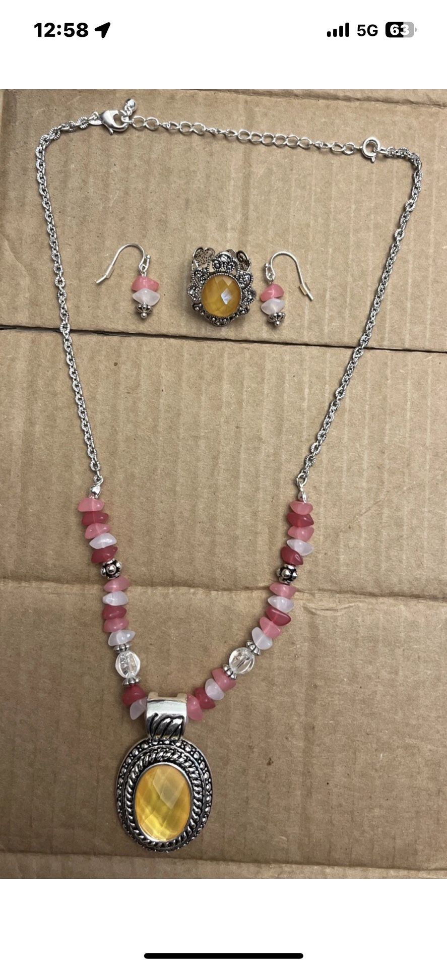 Silver tone, pink, white and clear beaded necklace, ring and earring set.