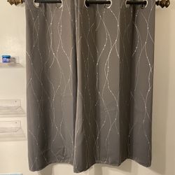 Smooth Grey Curtains With Silver Design And Rod.