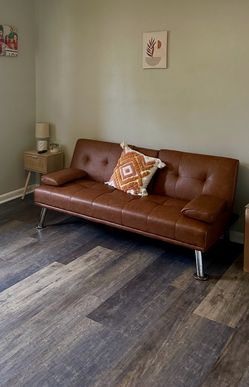 Brown faux leather futon