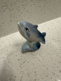 Porcelain mini ceramic dolphin figurine- 2 inches wide by 1 1/8 inches deep