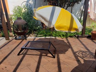 Grill or umbrella with its on clump