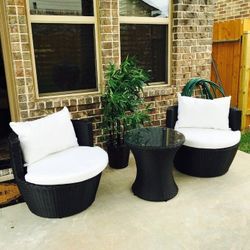 Outdoor patio wicker garden chairs and coffee table 