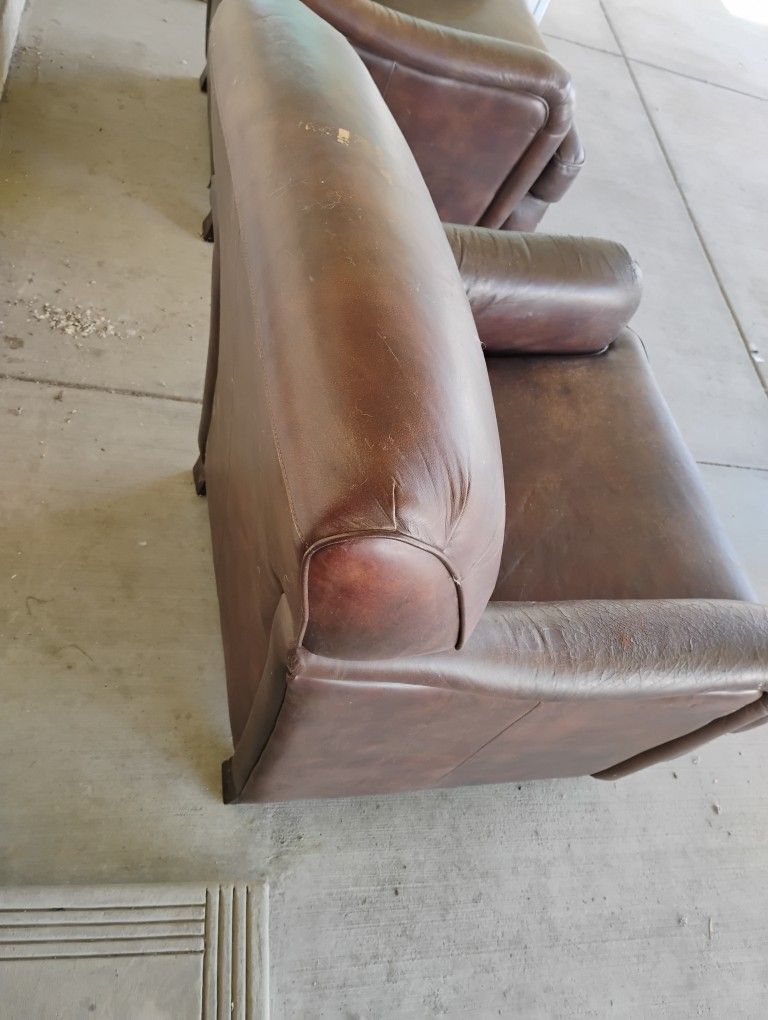 2 BROWN LEATHER ARMCHAIRS