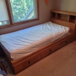 Twin bed with wood headboard, 3
storage drawers. OBO