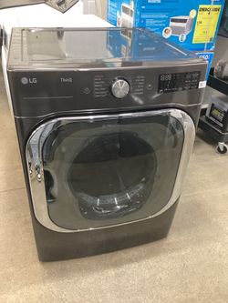 LG TurboSteam 9.0 cu.ft. Stackable Vented Electric Dryer with Steam Cycle New Scratch and Dent