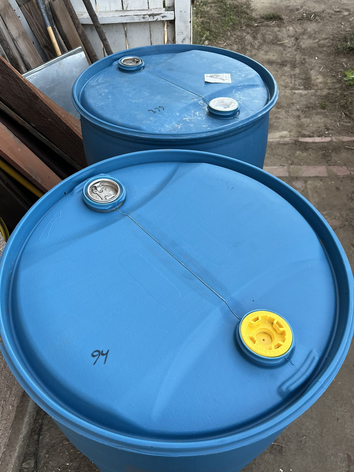 55 gallon Plastic Drums clothes top $20 each