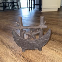 Texas Centennial cast iron boot scraper or doorstop, featuring a crescent moon, star, and longhorn motif