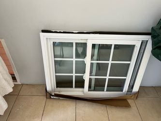 White Vinyl Sliding Window with Grids