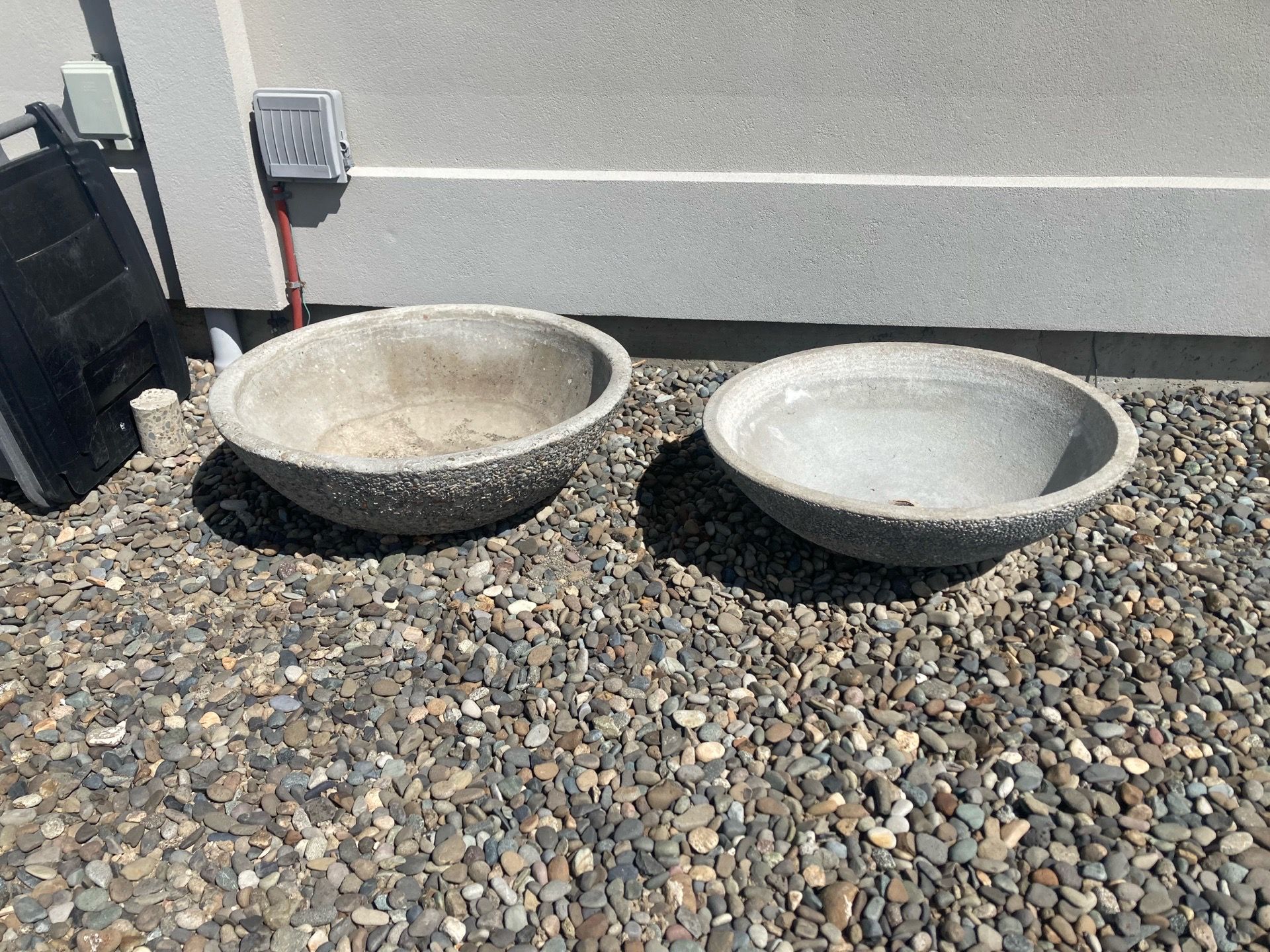 Concrete Aggregate Bowls for flowers, fountains and fire pits. One bowl is 39” in diameter and the other is 36” in diameter.